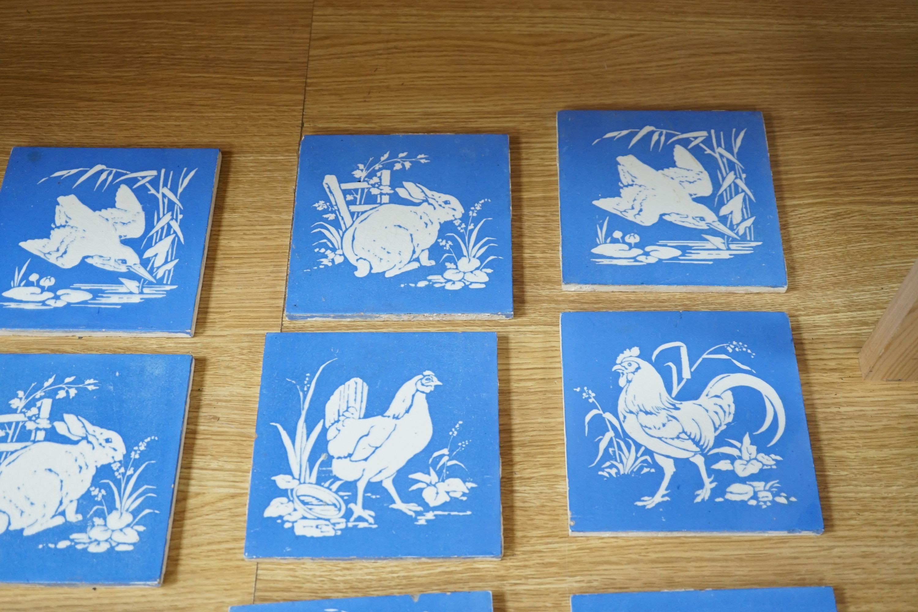 A collection of twelve Mintons China Works blue and white bird tiles, 15cms x 15cms square (each tile).